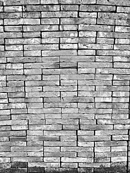 Grunge horizontal blackÃ¢â¬â¹ andÃ¢â¬â¹ whiteÃ¢â¬â¹ tone brick wall. photo